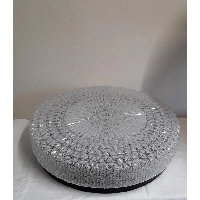 Vintage Flat Round Ceiling Lape with Plastic Screen in Ice Glass Optics of Black Metal Assembly, 1970s, in Very Good...