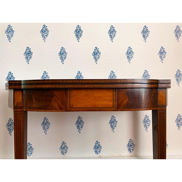 Revitalizing the Neoclassical style that was first popular in the late 1700s and early 1800s, this mahogany game table was...