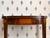 Revitalizing the Neoclassical style that was first popular in the late 1700s and early 1800s, this mahogany game table was...