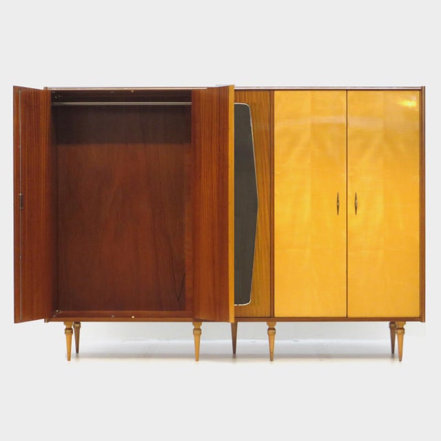 Large vintage mid-century modern 5-door wardrobe in a beautiful combination of maple and teak from the 1950s. The wardrobe...