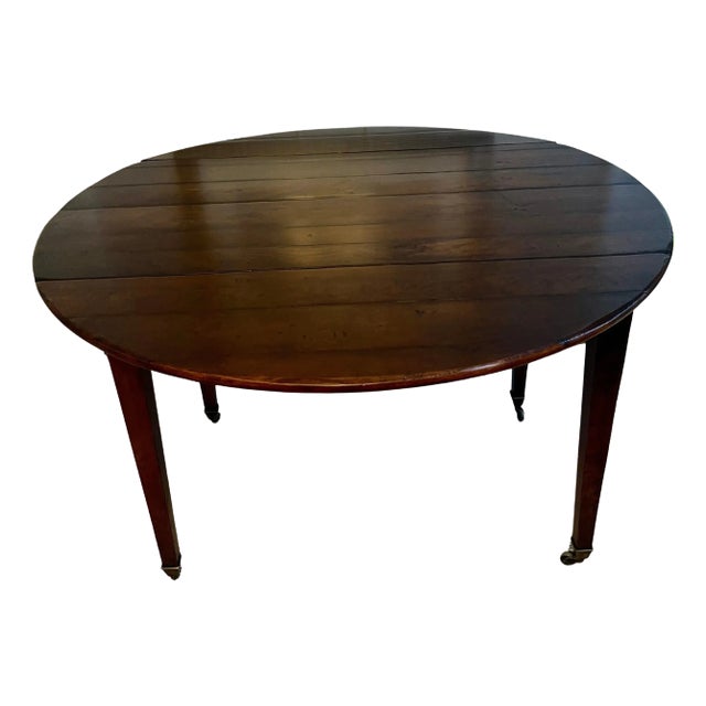 Early 20th Century Walnut Directoire Drop Leaf Table with Brass Sabot's For Sale