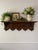 A superb antique carved wood French Wall Coat and Hat Rack with Shelf in a rich dark stain, circa Early 20th Century. This...