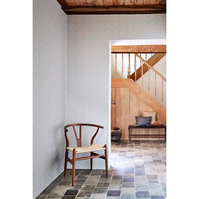 Smart and contemporary this wallpaper design originated as the Diaper design c.1868. The design studio removed the daisy...