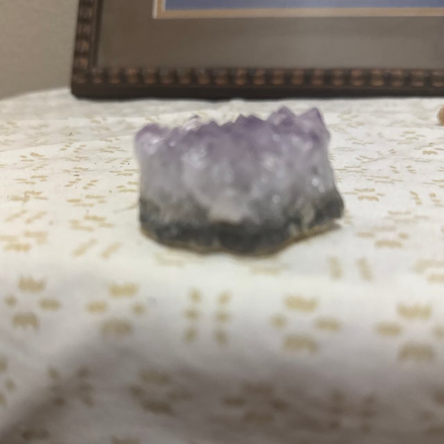 Beautiful natural amethyst crystal with a soft light purple color. This piece has a gentle, calming appearance and shows...