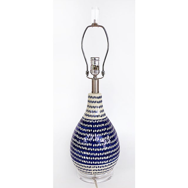 Mid-century Cobalt Blue, White Ceramic Table Lamp, Lucite Base and Finial Offered for sale is mid-century modern style...