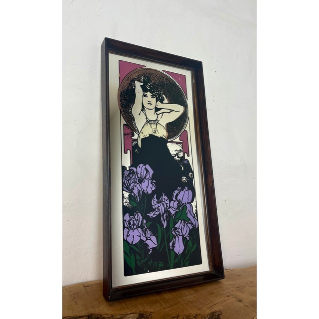 Beautiful vintage-framed mirror featuring an Art Nouveau illustration of a woman by the Czech artist Alphonse Mucha....