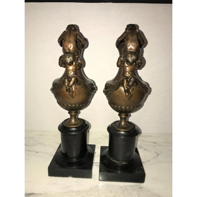 Pair of 19th C. Urns on Marble Stands Bearing Cherubs & Rams Heads