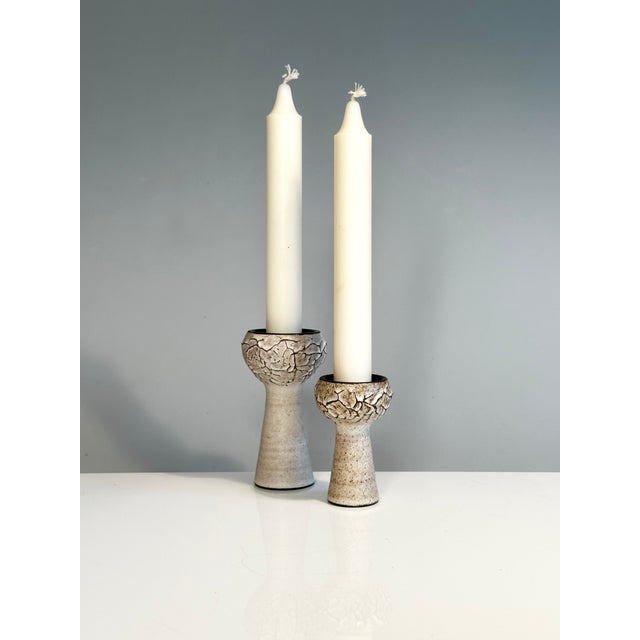 Two handcrafted studio ceramic pieces by Heiner-Hans Körting, each with a striking, relief-like textured surface...