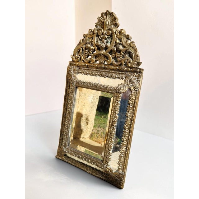Repoussé Brass Mirror with Side Panels, Louis XIV Style — Napoleon III Period, 19th Century Charming mirror known as a...