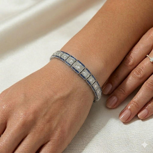 Platinum engraved Art Deco period bracelet with 37 Old European cut diamonds weighing approximately 12.00 carats. Accented...