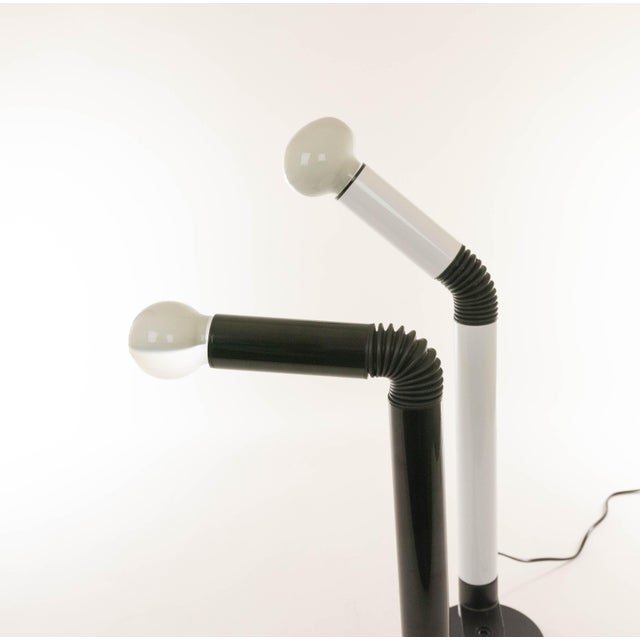 A pair of Periscopio table lamps with clamp and a matching base by Danilo and Corrado Aroldi for Stilnovo, 1967. As...