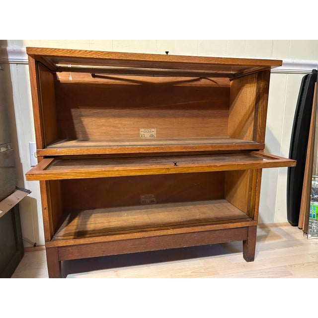 Vintage 3 piece globe wernicke barrister oak stacking bookcase. 2 glass front stackable bookcases and a base. Does not...