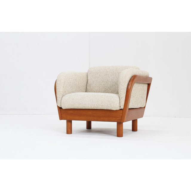 Vintage Danish Mid Century armchair in solid teak by Olsen Laursen from the 1960s with beautiful curved shape. The chair...