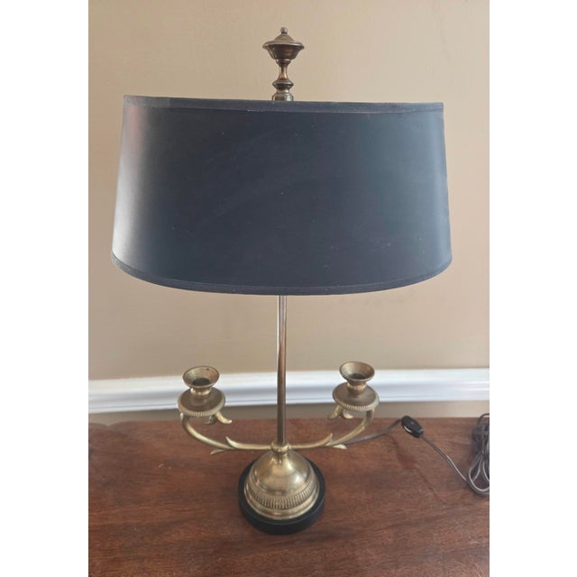 Bring classic elegance to your home with this exquisite vintage French-style brass bouillotte candelabra lamp. Strongly...