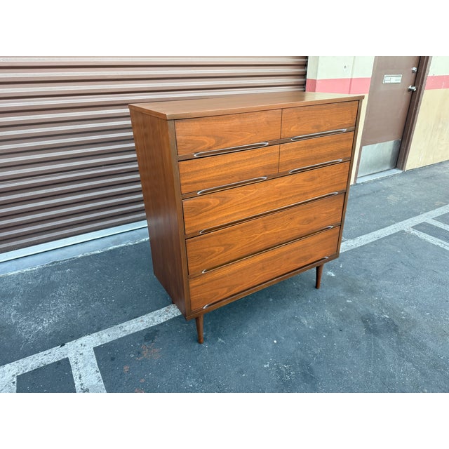 Fantastically simple authentic vintage walnut high boy dresser. The dresser is unmarked but highly probable to be American...