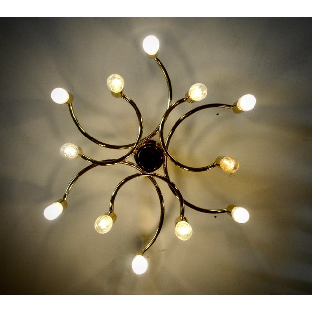 A midcentury chandelier made in Germany in the 1970s. It is fascinating with its Space Age design. The body of the light...