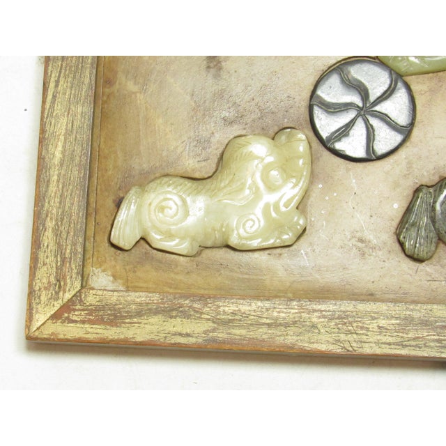 Vintage Chinese carved hard stone picture, c.1950’s 3 carved foo dogs around a central ball. These are inset into a hard...