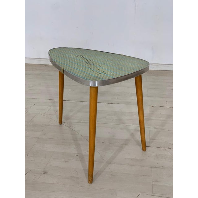A beautiful coffee table/kidney table. The top plate has stains, see the pictures. • German Design • 60s • good condition...