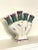 On thi five finger, (tulipiere) vase there is an embossed lattice feature embedded on each "finger" opening, as well as,...