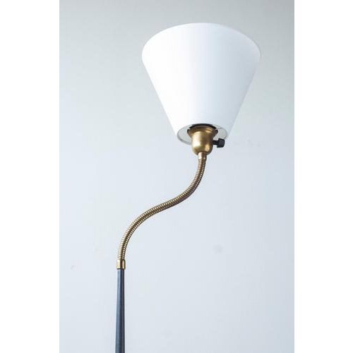 Floor lamp produced by asea belysning in sweden. Made during the 1950s. Elliptically shaped stem with heavy cast iron base...
