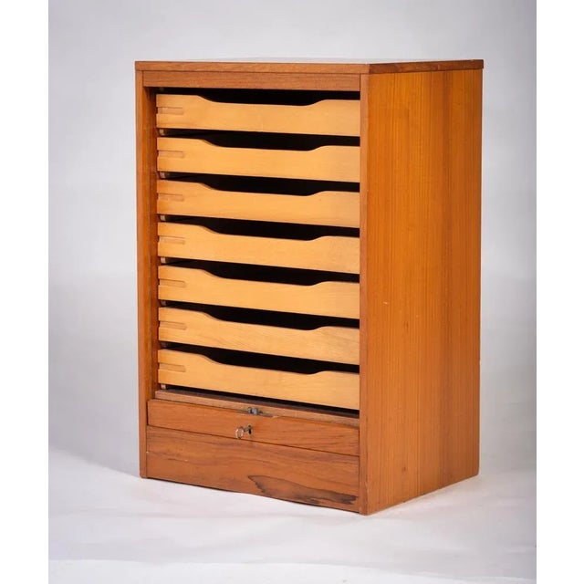 Banish the ugly metal file cabinet from your office! This sleek Danish beauty features a disappearing tambour door and...