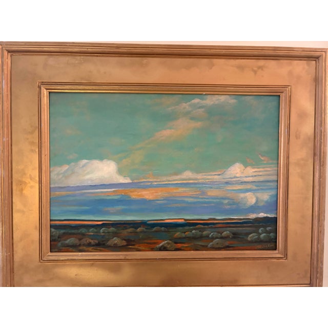 Look at the colors in this beautiful painting. Serene painting of a water scene with clouds in the sky. Painted by...