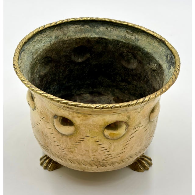 A beautiful vintage Italian repoussé brass footed cachepot planter. Marked "Made in Italy" on reverse. This gorgeous...