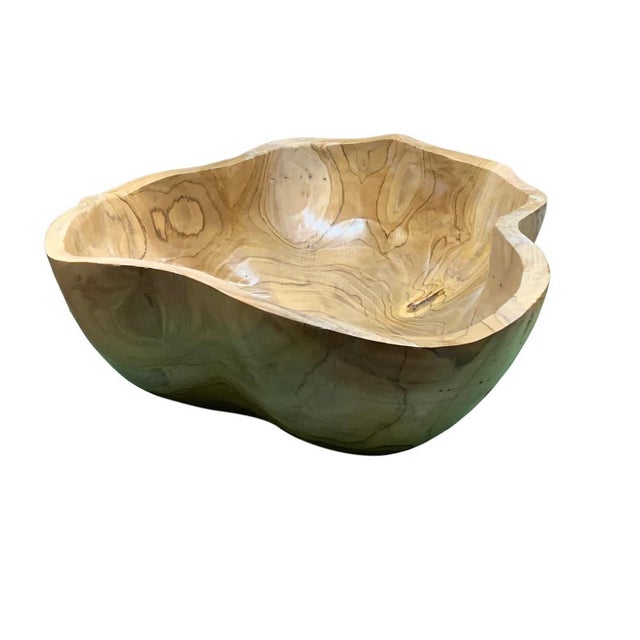 This teak live edge bowl is a unique piece showcasing the natural beauty of teak wood. Crafted by skilled artisans, its...