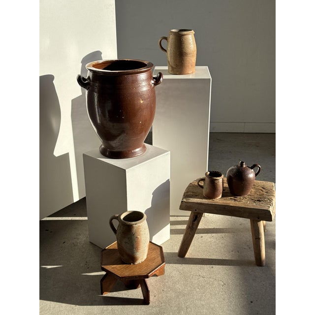 Very large antique brown glazed terracotta pot with two handles. Damaged inside and out, may be fragile. Height: 41cm;...