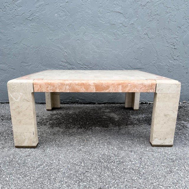 This postmodern square coffee table showcases the artistry of tessellated stone in a soft beige and blush palette. Small...