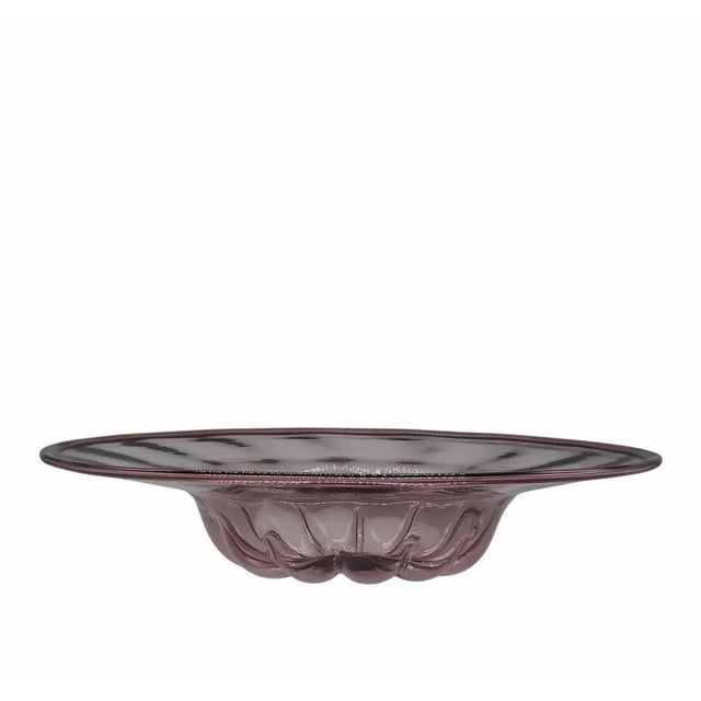 Large amethyst blown glass dish designed by Vittorio Zecchin for MVM Cappellin in the 1920s. The dish was produced in...
