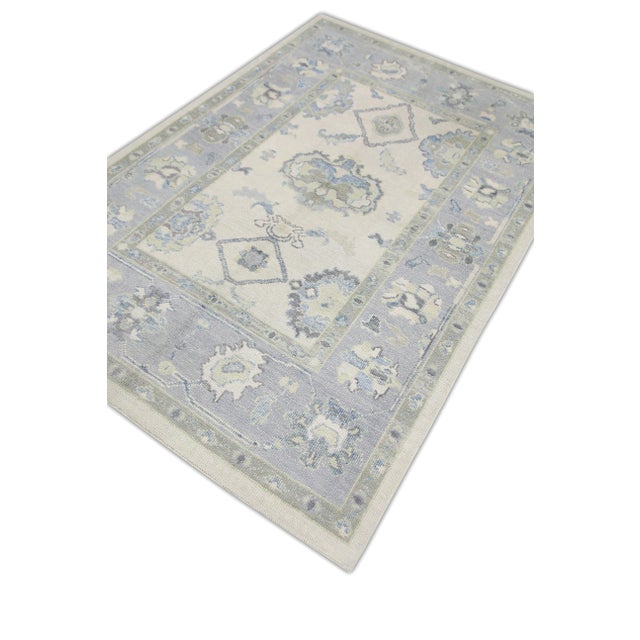 Elevate your home decor with this exquisite Handmade Modern Turkish Oushak Rug, measuring 4'10" x 7'. Featuring a...