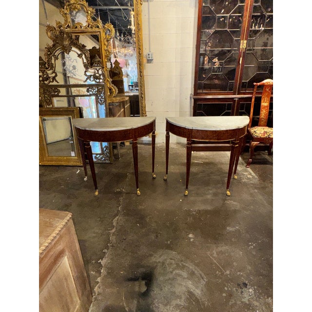 This product is a pair of 19th-century elegant Italian walnut consoles. These handsome pieces add a touch of historical...