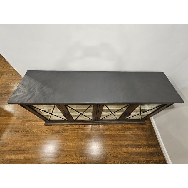 Canyon Ridge Collection by Bernhardt Furniture Wire-brushed case in Desert Taupe finish Cast Concrete top in Basalt finish...