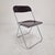 Iconic “Plia” folding chair designed by Giancarlo Piretti for Castelli, Italy. Executed in translucent brown molded...