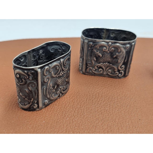 Pre-war plated napkin holders, price for 4 pieces, dimensions: height 3.7 cm, width 4.5 cm, depth 2.5 cm.