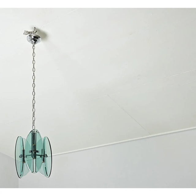 Dimensions: 12 ¼” H x 10 ¼” W x 10 ¼” D A vintage midcentury modern glass pendant light fixture made in Italy in the...
