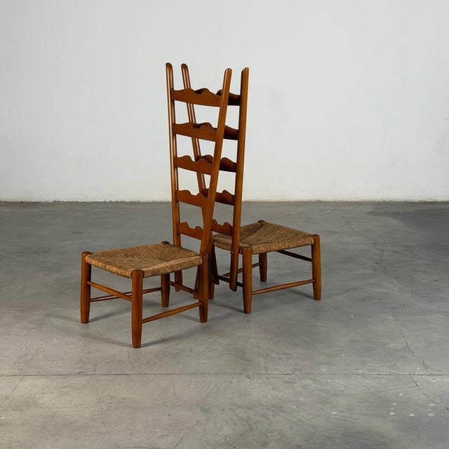 Sculptural and highly distinctive, this pair of fireside chairs was designed by Gio Ponti and produced by Casa e Giardino,...