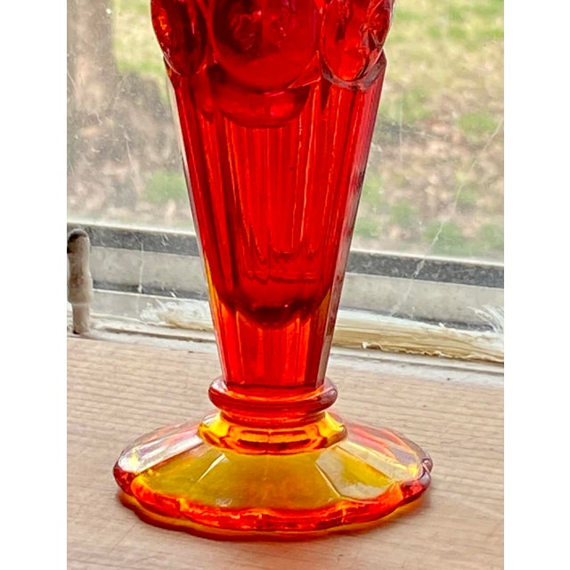 Luscious Moon and Stars pattern ruby red pressed glass trumpet bud vase with an amberina base with separate red ball...