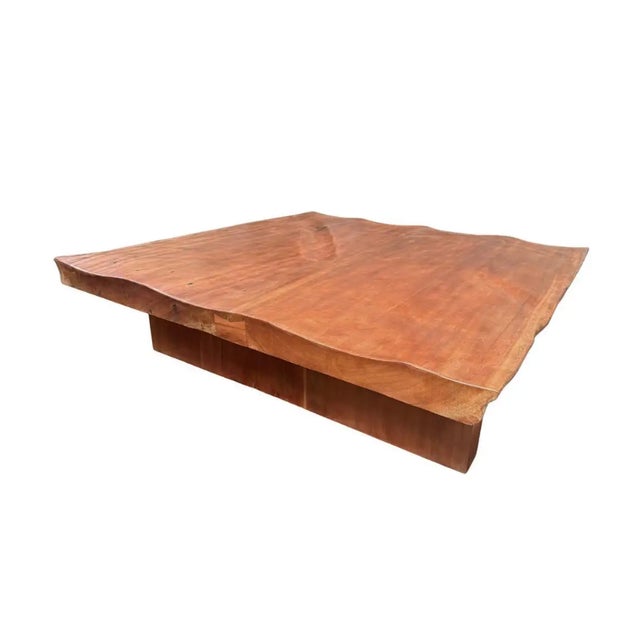 A striking celebration of natural material and contemporary craftsmanship, this substantial coffee table is handcrafted...