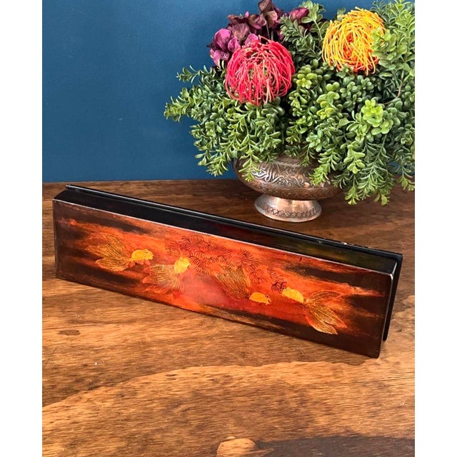 Elegant vintage Japanese lacquer desk organizer featuring a traditional goldfish motif set against rich black and deep red...