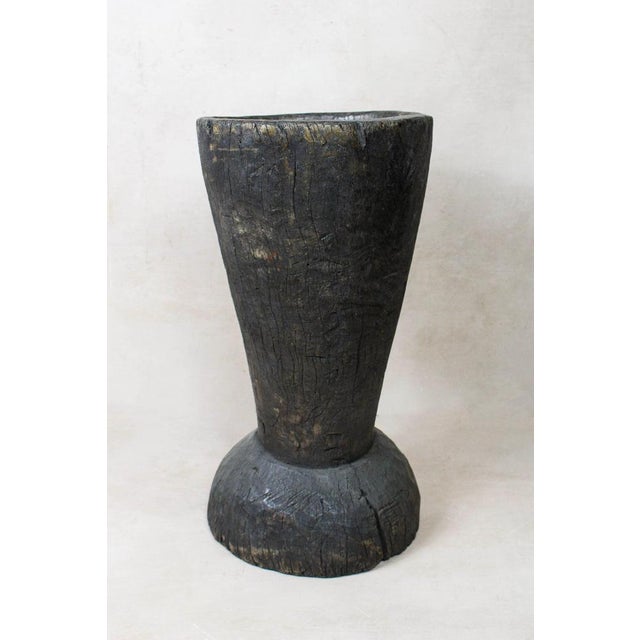 African grain stompers are made when they hollow out tree trucks and large branches to create these which are then used to...