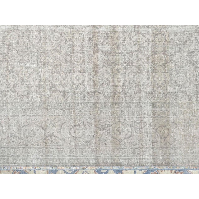 This Semi Antique Persian Tabriz Rug is hand woven in Northern Iran's Tabriz region and distressed before being refinished...