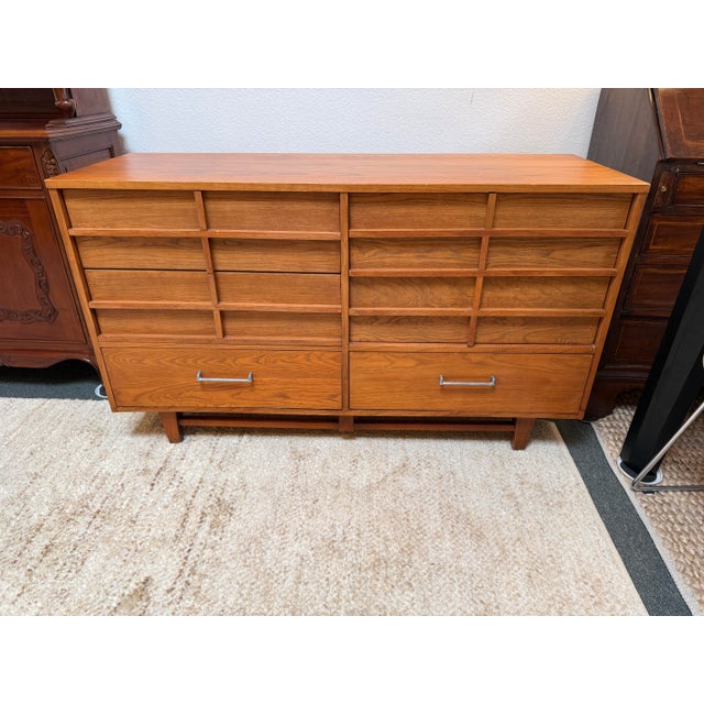 Design Plus Gallery presents a Teak Wood Dresser from Royal Palm. The unique dresser has six drawers that are all the same...