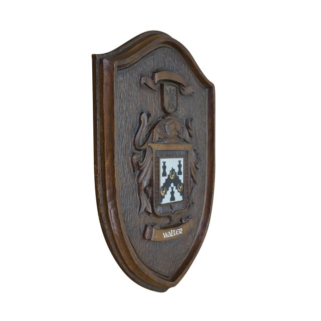 20th Century Black Forest Style Heraldic Family Coat of Arms Wall Plaque. Made from Mahogany with a carved shield centered...