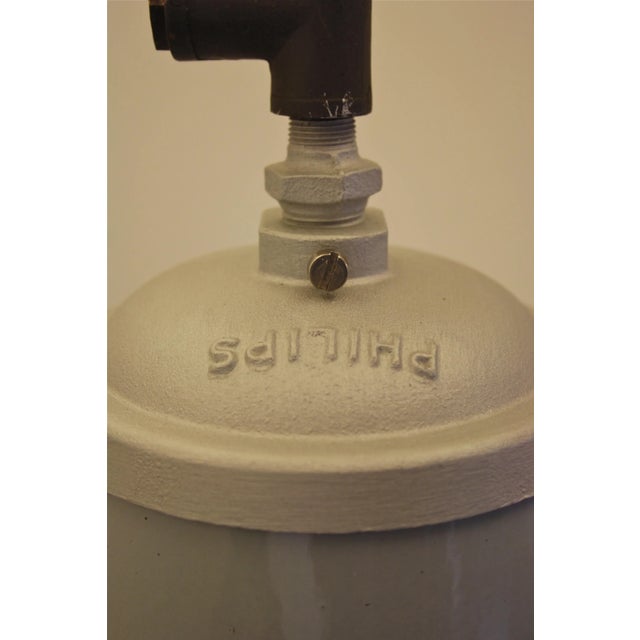 This is an enamel pendant in grey from Philips. This piece has an attribution mark, I am sure that it is completely...