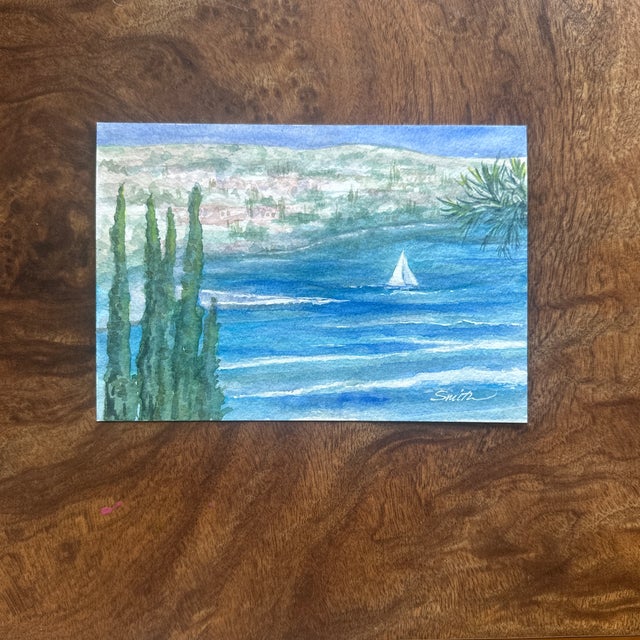 From my own reference from a photo taken in Nice, France. A serene coastal scene with a lone sailboat gliding through...