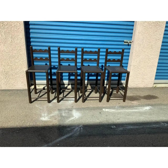 Set of 4 country French solid oak counter stools. Stools are done in a rich walnut finish. The stools were custom made....