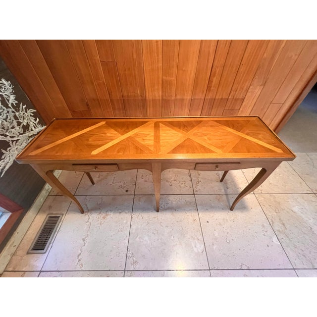 Elegant vintage console table by Bodart, crafted with beautiful parquetry inlay top and classic French Provincial styling....