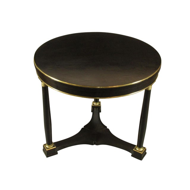 Late 19th-C. French Empire center table with black lacquer finish and original brass trim and fittings.